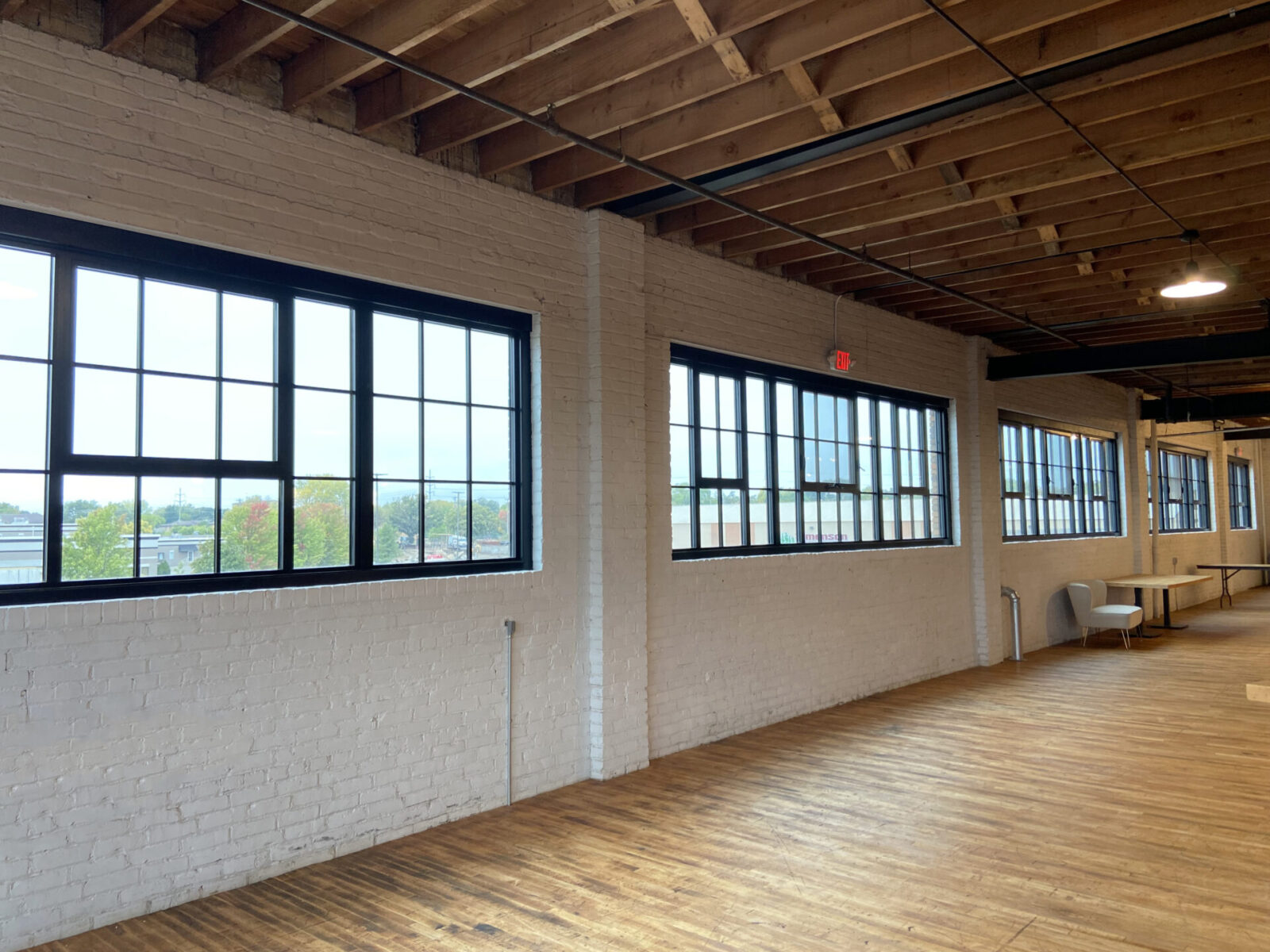 Harvester Square five openings, each with three historic replica awning windows